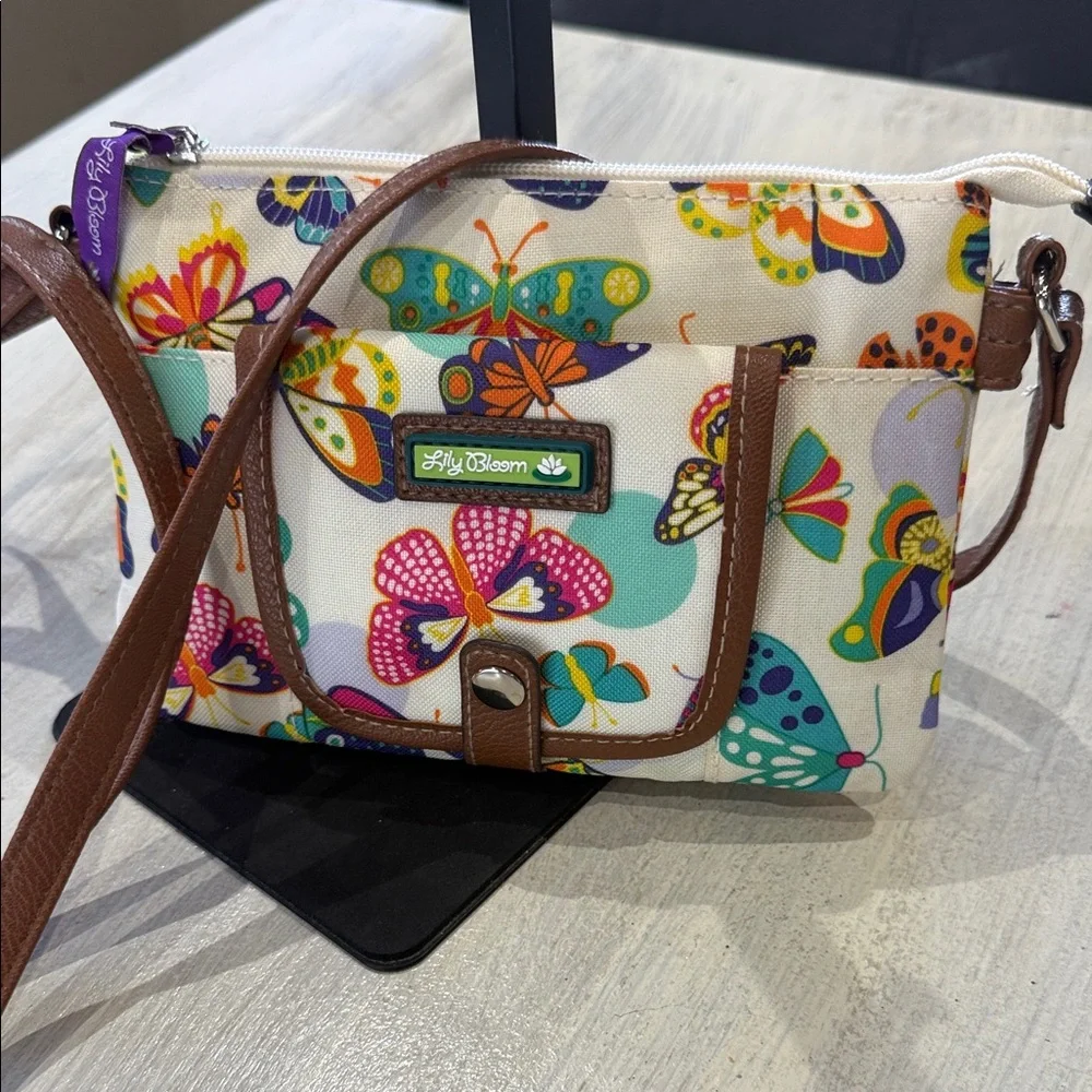 Lily Bloom Cream Crossbody Bag with Multicolor Butterfly Print and Brown Trim - Picture 1 of 12